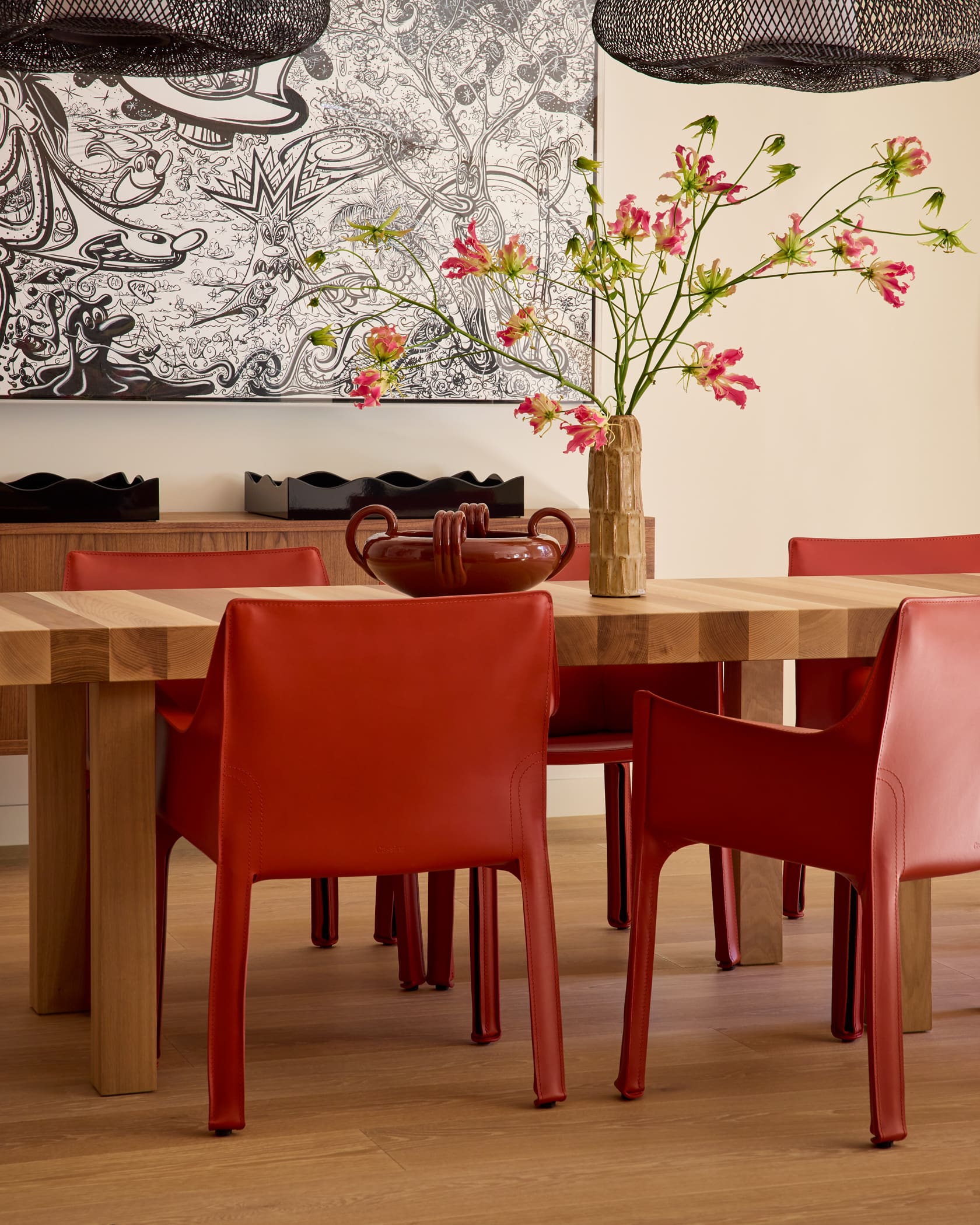Eclectic dining space with Campana Brothers sideboard and curated art collection in downtown Aspen penthouse